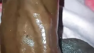 Chocolate meat stick - jacking off his big black dick with oil