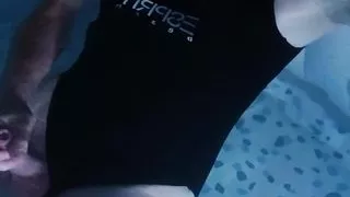 Sissy wearing Black one piece swimsuit on swimming pool