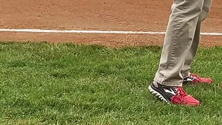 Jerking off and cumming on a baseball field diamond