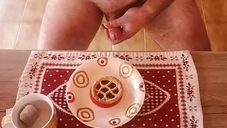 Cicci77 masturbates her beloved Pedro to produce a lot of sperm by ejaculating on a tart that he will then eat for breakfast