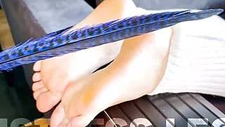 Smearing cream and tickling with a feather bare feet in white gaiters POV