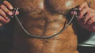 Muscle Daddy blows flexing and using his nipple clmaps!