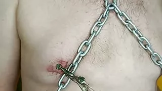 Let's play painfully with your nipples, my BDSM slave in a gas mask. Dominatrix Nika plays with male nipples with clamps.