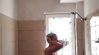 Nadezhda decides to open the window while taking a shower