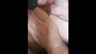 Horny slut giving handjob