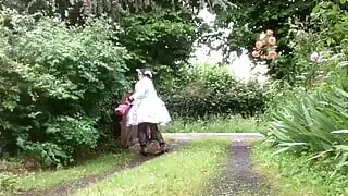 In a green maid outfit for a day's work in sewing
