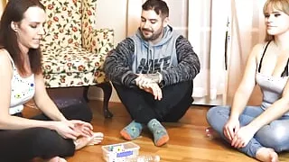 A strip game of spin the bottle between three good friends