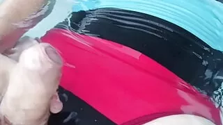 Tranny wearing sexy one piece swimsuit and swimming