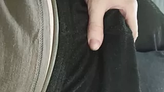 Caressing his cock in black sweatpants