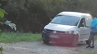Outdoor car windows cleaning by the road