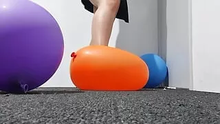 Women Popping balloons, stomping on balloons