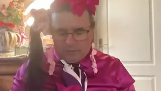 In an outfit with a little pink skirt to suck a dildo