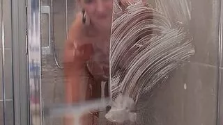 MILF taking butt plug into her ass and then taking a shower