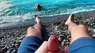 Skinny twinky sucked the big of a stranger jerking off to him on a public beach