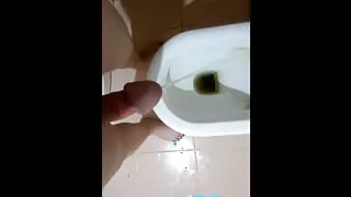 I pissing in the toilet with my little tranny dick and then masturbate and cum
