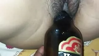 Bengali girl take a beer bottle in her pussy