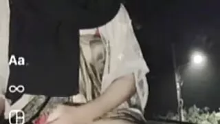 Crossdresser hijab wear red CD play at outdoor