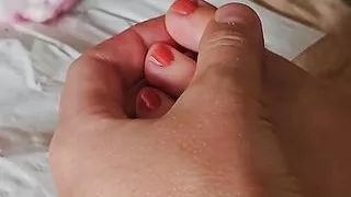 The wife does her nails topless and in a bikini, legs with nail polish, foots nails