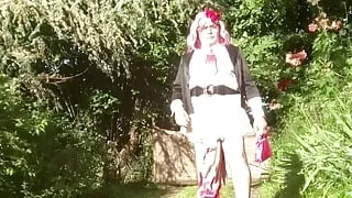 Dressed with a little short pink ruffle skirt and a pink wig for a night out