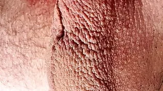 Close-up testicles massaging until big cumshot