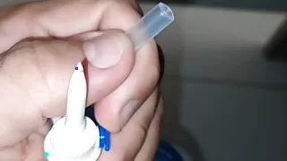 Preparing the stick for application of the serum directly into the glans vein.