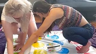 Two hot lesbians are playing a strip twister game