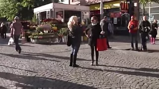 Blonde woman in black lingerie banging on the bed