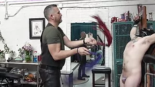 Flogging masked slave on St Andrews Cross PREVIEW