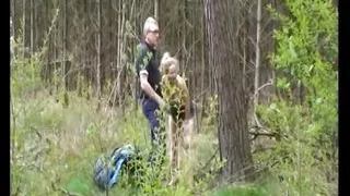 Naughty teen is blowing two hard cocks outdoors