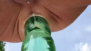 Bottle in ass