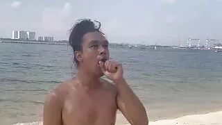 Caged Singapore Oiled Slave at the Beach and deep throating a black didlo