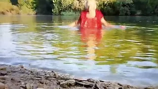 Swimming in the lake in violet skirt and red t-shirt wetlook