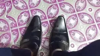 Leather Boot black shining and feet.