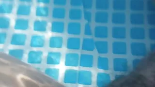 Underwater foot job in the back yard pool