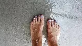 Showing off our feet and pedicures while wet
