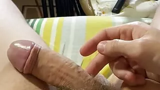 Elastic boy makes his rubber cock harden and soften at the same time.