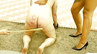 Severe pool caning in the sand - Mistress Zeida Lady Mahogany