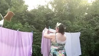 In outfit with a small short floral dress to pick up the laundry