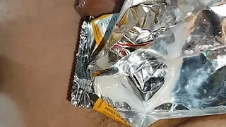 Boy's fetish on accumulating the load in plastic packaging after the intense orgasm.