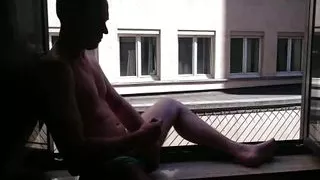 Short - Wanking in front of open hotelroom window with cumshot