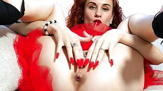 Ariel Ortiz eats a lollipop while she puts a giant dildo in her pussy