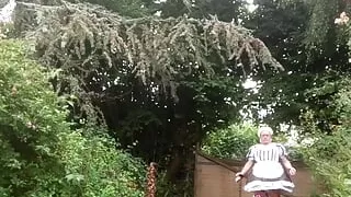 In a maid's outfit to drop off garbage bags