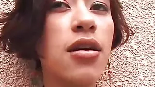 A Horny Asian Smokes a Cigarette While Making Herself Cum with a Sex Toy