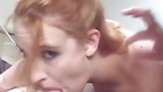 Big tits Redhead gives his small dick a blowjob while her friend watches