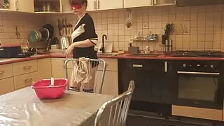 Sexy Dressed Wife Preparing Food in the Kitchen