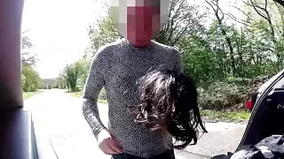cross dress changing in public car park as cars drive past
