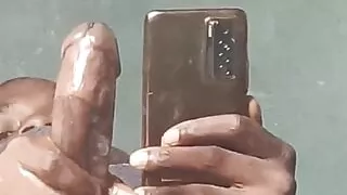 Black dude bigdickkronos strokes his big oily cock in homemade action.