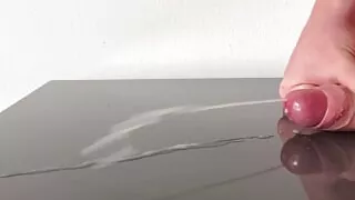Huge cumshot on reflecting table after days of edging