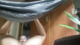Arabian babe swings in a hammock with open anus ready to fuck