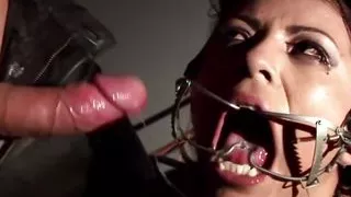 Restrained babe sucks her master's big and hard cock